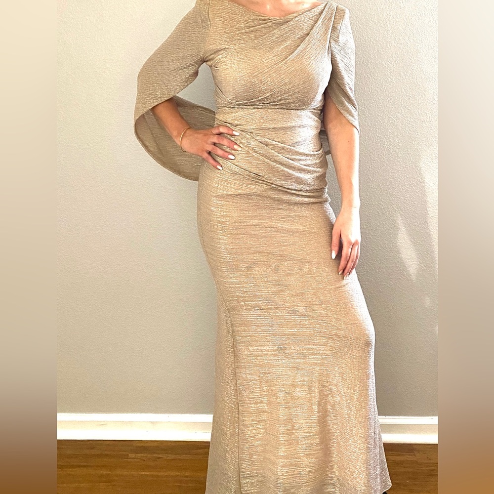 A gorgeous gold Betsy & Adam size 4 gown. Perfect for many special occasions
